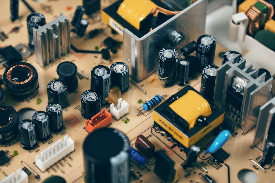 Detailed shot of capacitors and resistors on a circuit board, showcasing modern technology